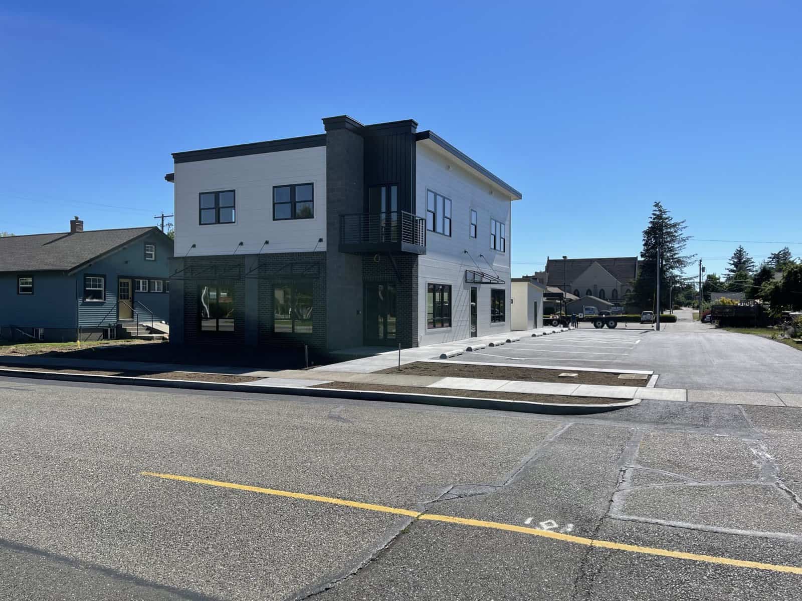 Mixed-use commercial development on 4th Street, Lynden, Whatcom County — civil and stormwater design by AXE Engineering.