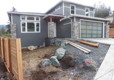 Newly constructed and incomplete single family home with stormwater drainage design courtesy of Axe Engineering